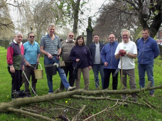 Friends of Beeston Cemetery and Holbeck Cemetery take a break from clearing up in the graveyard at St Mary's Church in June 2002.