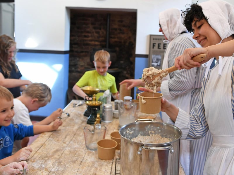 Youngsters enjoy making bread and porridge in the kitchen of the new-look Ripon Workhouse Museum. (Picture Gerard Binks)