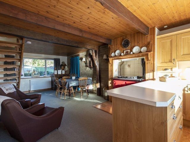 The open plan beamed fitted kitchen with diner.