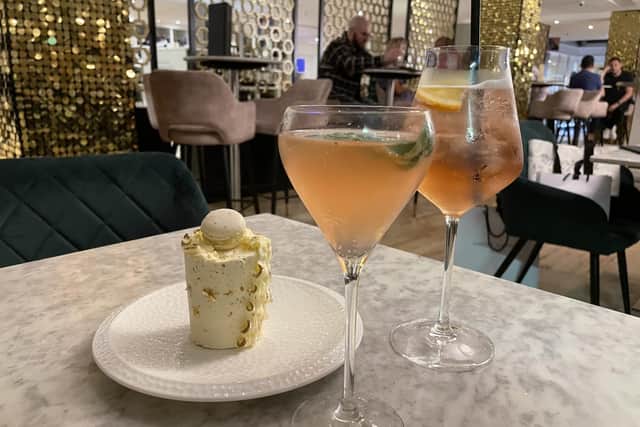 The Curtain Call cocktail, with a Moet Chandon Garden Spritz and an ornately decorated Victoria Sponge at Harvey Nichols' Fourth Floor Bar in Briggate, Leeds.