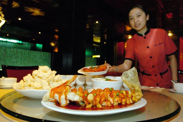 Did you enjoy a meal here back in the day? Red Chilli restaurant in Leeds city centre. Pictured is Soo Chen Teh carrying a Saute king prawn dish, pictured with the Crispy yellow cracker with sweet and sour sauce, assorted seafood and served with rice crisps.