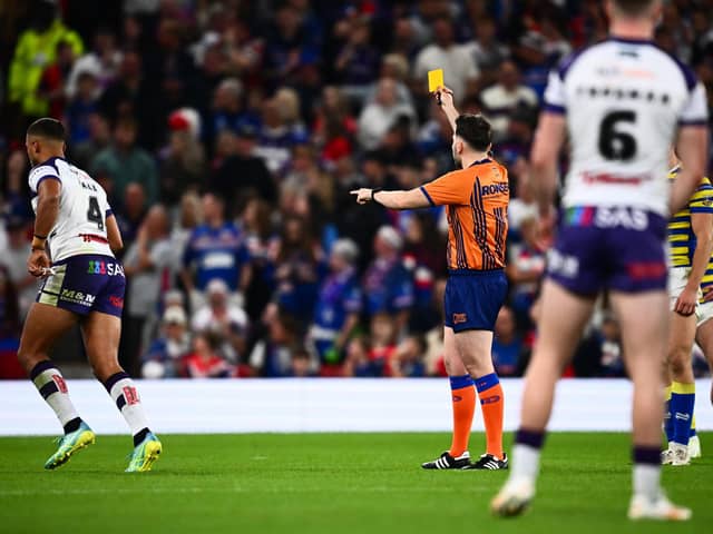 Referee Liam Moore shows a yellow card to Wakefield Trinity's Corey Hall during the Super League Grand Final. Picture by Olly Hassell/SWpix.com.