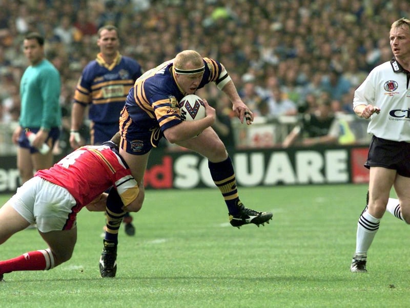 Rhinos' Aussie prop Jamie Mathiou is tackled.