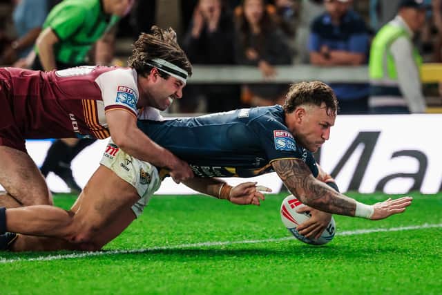 Chris Hankinson touches down for Leeds Rhinos' ninth and final try in the 52-5 thrashing of Huddersfield Giants. Picture by Alex Whitehead/SWpix.com.