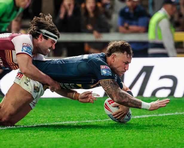 Chris Hankinson touches down for Leeds Rhinos' ninth and final try in the 52-5 thrashing of Huddersfield Giants. Picture by Alex Whitehead/SWpix.com.