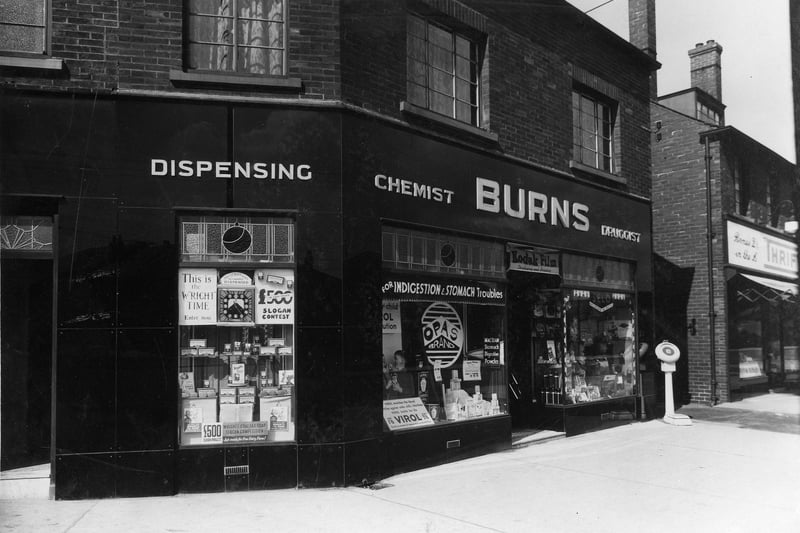 Burns Chemist on junction of Old Lane and Dewsbury Road in April 1936. A weighing machine can be seen outside shop on pavement.