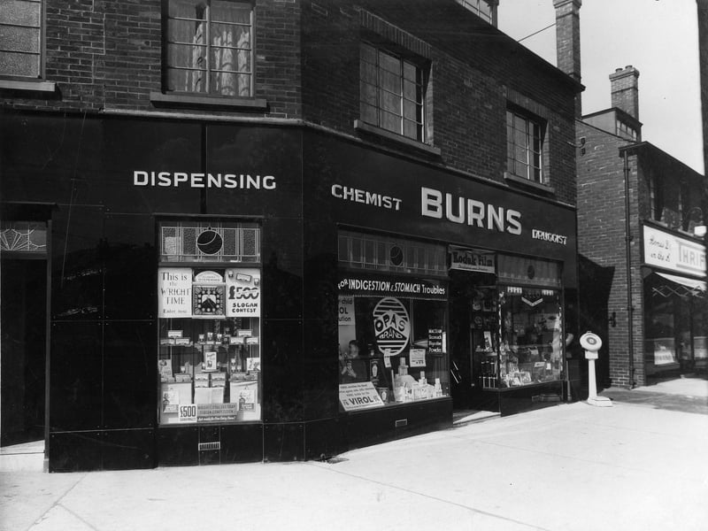Burns Chemist on junction of Old Lane and Dewsbury Road in April 1936. A weighing machine can be seen outside shop on pavement.