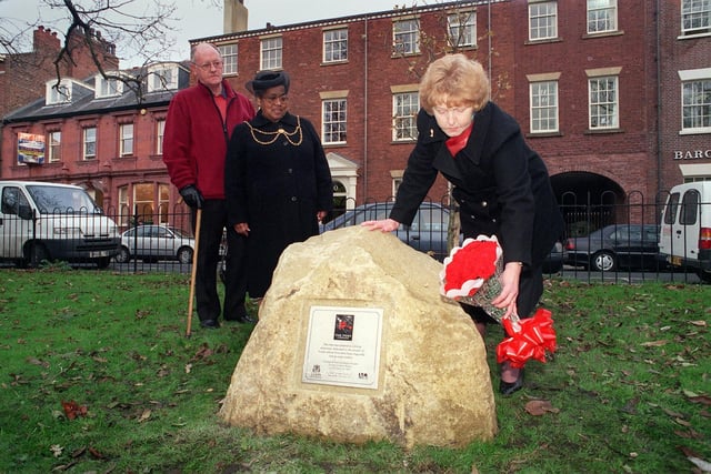 November 1999 and deputy Lord Mayor of Leeds Coun Jean White (centre) along with Frank Whittingham, from Support and Care after Road Death and Injury watch Hilda Armstrong, co-ordinator of Campaign Against Drink Driving, lay posies at the unveiling of a plaque on Park Square to commemorate victims of  the city's roads.