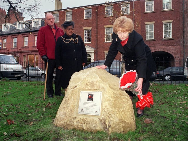 November 1999 and deputy Lord Mayor of Leeds Coun Jean White (centre) along with Frank Whittingham, from Support and Care after Road Death and Injury watch Hilda Armstrong, co-ordinator of Campaign Against Drink Driving, lay posies at the unveiling of a plaque on Park Square to commemorate victims of  the city's roads.