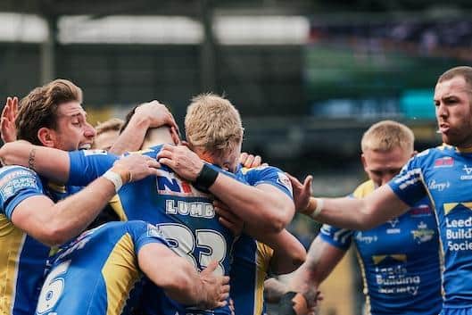 Rhinos players celebrate during the win at Hull FC, but some fans weren't happpy at the end despite the win. Picture by Alex Whitehead/SWpix.com.