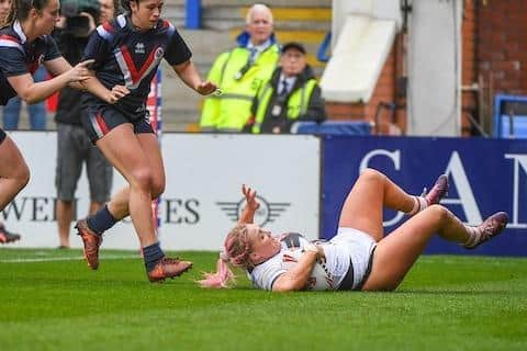 Amy Hardcastle scores England's 11th try to complete a huge win over France. Picture by Olly Hassell/SWpix.com.