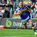 Aidan Sezer scores the last-gasp try agianst Castleford Tigers which secured Leeds Rhinos' place in the 2022 Super League play-offs. Picture by Bruce Rollinson/SWpix.com.