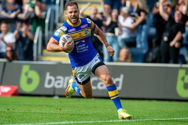 Aidan Sezer scores the last-gasp try agianst Castleford Tigers which secured Leeds Rhinos' place in the 2022 Super League play-offs. Picture by Bruce Rollinson/SWpix.com.