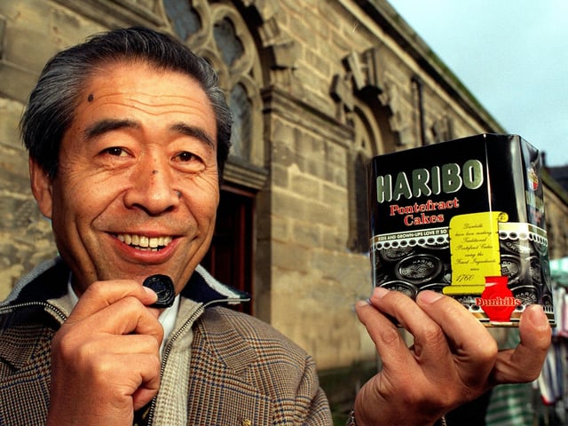 Japanese businessman Akifumi Higurashi  tries out Pontefract Cakes on his visit to the town in November 1997.