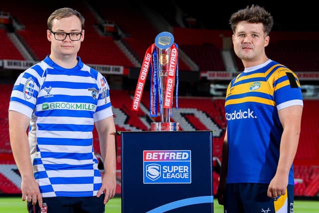 Leeds Rhinos' Tom Halliwell, right and Finlay O'Neill, of Halifax Panthers, with the Betfred Wheelchair Super League trophy. Picture by Allan McKenzie/SWpix.com.