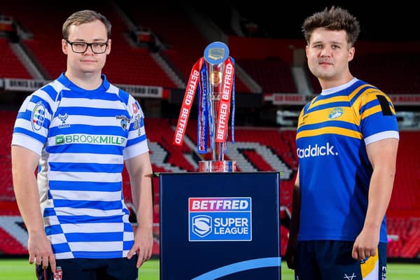 Leeds Rhinos' Tom Halliwell, right and Finlay O'Neill, of Halifax Panthers, with the Betfred Wheelchair Super League trophy. Picture by Allan McKenzie/SWpix.com.