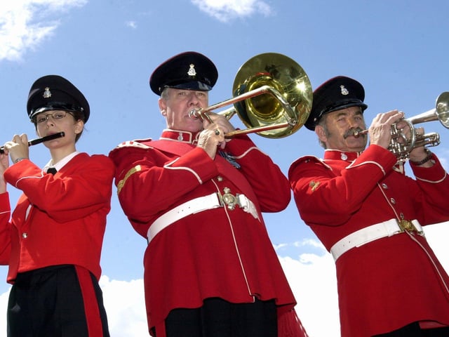 Members of the Yorkshire Volunteers Marching Band prepare for their trip to a military festival in Germany. From left, Claire Stephenson, Allan Millward and Harold Westwood, pictured on July 2, 2002.