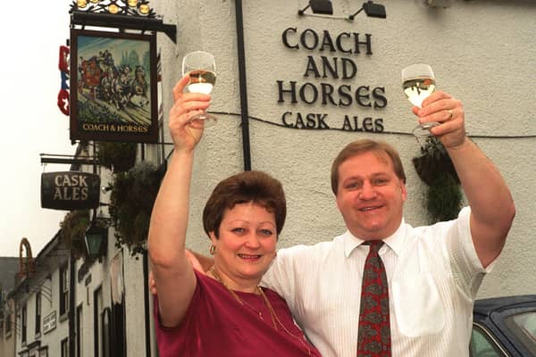 Coach and Horses pub licensee Val Goldthorpe and her husband Rob celebrate the watering hole on Commercial Street being nominated for Community Pub of the Year 97.