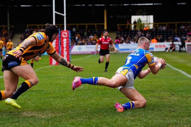 Harry Newman scores Leeds Rhinos' opening try in the 64-6 win at Castleford Tigers. Picture by Olly Hassell/SWpix.com.