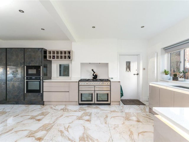 The well-appointed dining kitchen has fitted wall and base units, ample worktop space and a variety of integrated appliances.