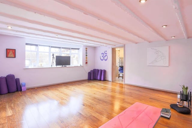 This very spacious bedroom has the advantage of it's own private entrance door from the driveway. This is currently used by the vendors as a cinema room, however could be used as a home gym, yoga room, annexe for family members or guests or as a home office.