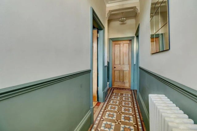 The main living space is over two floors and includes this attractive entrance hall.