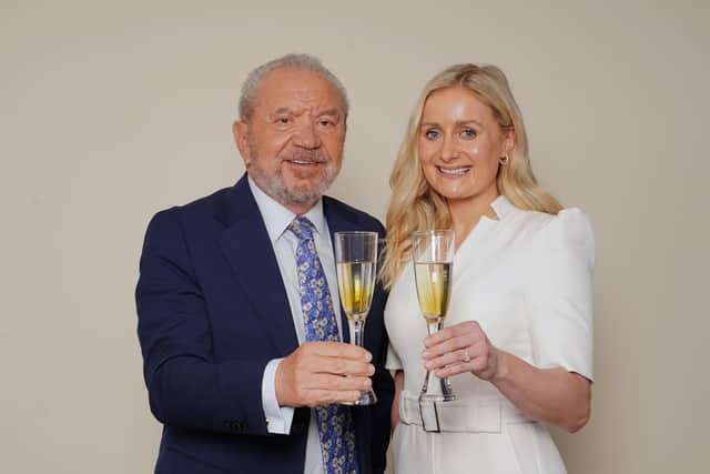 Rachel Woolford winner of the latest series of the BBC programme The Apprentice, with Lord Sugar in the boardroom of Amshold House in Loughton, Essex.  Ian West/PA Wire