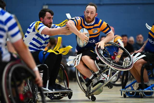 Leeds Rhinos' Nathan Collins is tackled by Joseph Calcott, of Halifax Panthers, during the sides' Super League meeting at The Edge, University of Leeds, last month. Picture by Olly Hassell/SWpix.com.