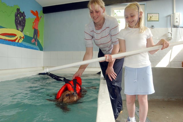Jo Hamilton, owner of Carlton Hydrotherapy Pool for dogs, at Carlton, near Yeadon, was running a sponsored doggy paddle in May 2003. She is pictured with Georgia Rae and her King Charles Spaniel Lucy.