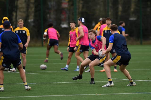 Rhinos' 17-year-old half-back Fergus McCormack gets a pass away at training this week. Picture by Jonathan Gawthorpe.