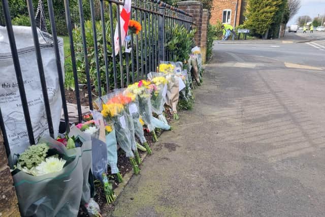 Flowers left at the scene of the crash on Keighley Road in Illingworth