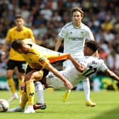 LEEDS, ENGLAND - AUGUST 06: Leander Dendoncker of Wolverhampton Wanderers is challenged by Tyler Adams of Leeds United during the Premier League match between Leeds United and Wolverhampton Wanderers at Elland Road on August 06, 2022 in Leeds, England. (Photo by David Rogers/Getty Images)