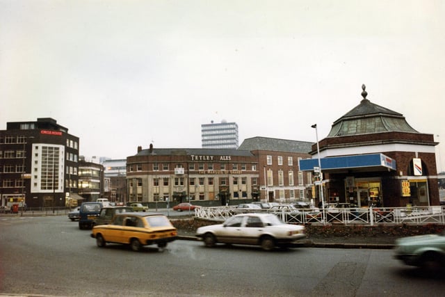 Eastgate roundabout from the direction of St. Peter's Street in March 1983. Circle House is on the left and the Marquis of Granby public house in the centre. A petrol filling station occupies the centre of the roundabout.