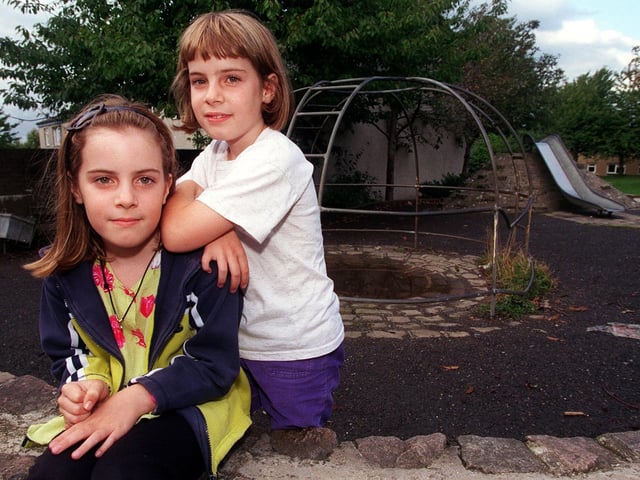 Twins Charlotte, left, and Lauren Collins who were injured after falling from the climbing frame near their home in Holt Park in September 1999.