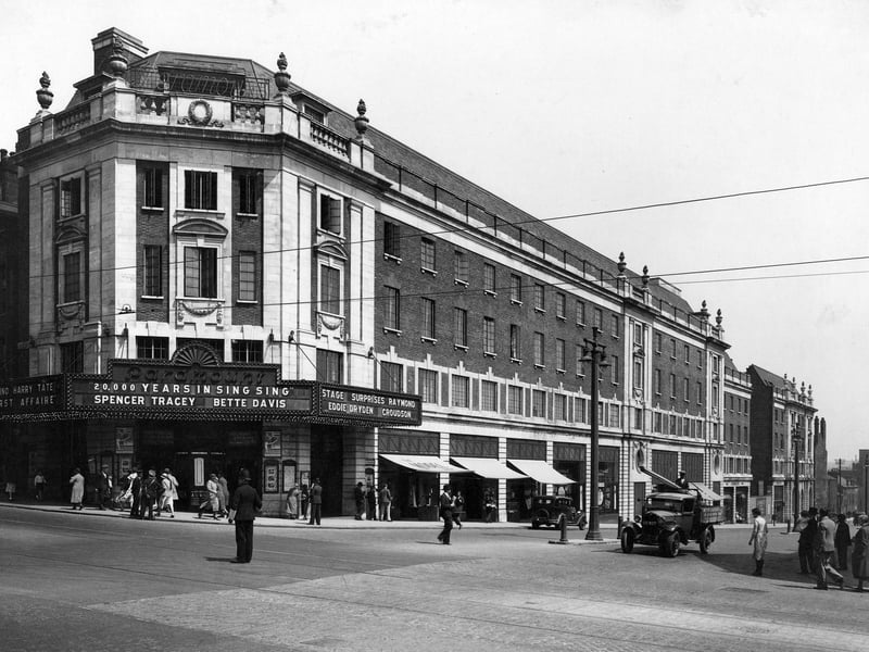 The Paramount Cinema at the junction with New Briggate. Designed by Frank T. Verity in keeping with Sir Reginald Blomfield's uniform scheme for the north side of the Headrow following road widening, it was opened on February 22, 1932. On show here is 20,000 Years in Sing Sing starring Spencer Tracy and Bette Davis, as well as Her First Affaire with Ida Lupino and Harry Tate. The cinema's name changed to The Odeon on April 15, 1940 and it closed down in October 2001. A new Primark store opened in the building in 2005.