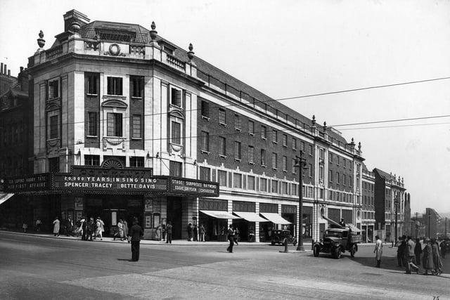 The Paramount Cinema at the junction with New Briggate. Designed by Frank T. Verity in keeping with Sir Reginald Blomfield's uniform scheme for the north side of the Headrow following road widening, it was opened on February 22, 1932. On show here is 20,000 Years in Sing Sing starring Spencer Tracy and Bette Davis, as well as Her First Affaire with Ida Lupino and Harry Tate. The cinema's name changed to The Odeon on April 15, 1940 and it closed down in October 2001. A new Primark store opened in the building in 2005.