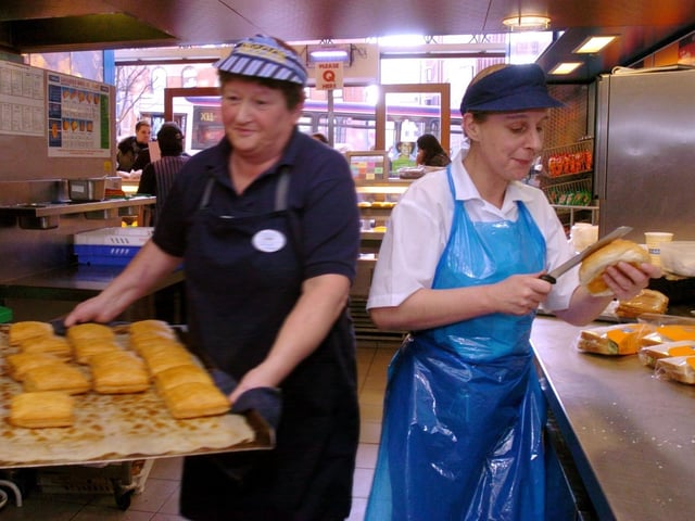The YEP went behind the scenes at Greggs bakery in Leeds city centre in 2004. Pictured is Sue Abbott, right, shop support manager, at Greggs on the Headrow,  preparing 'oval bites'.
