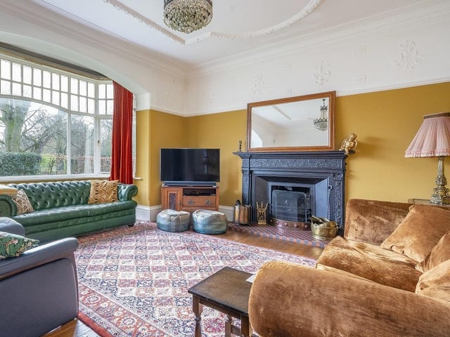 To the front elevation sits a wonderful, bay-windowed formal reception room. Next to it is a sizeable dining room with a pair of stained glass windows.