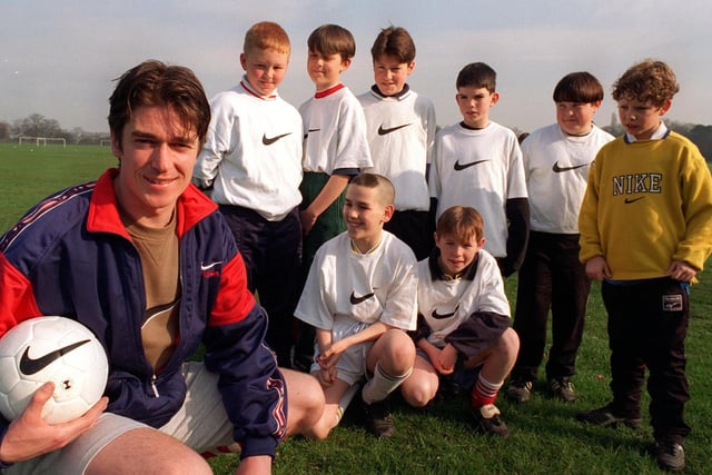 Youth football  coach Simon Clifford with young players at Roundhay in March 1997.