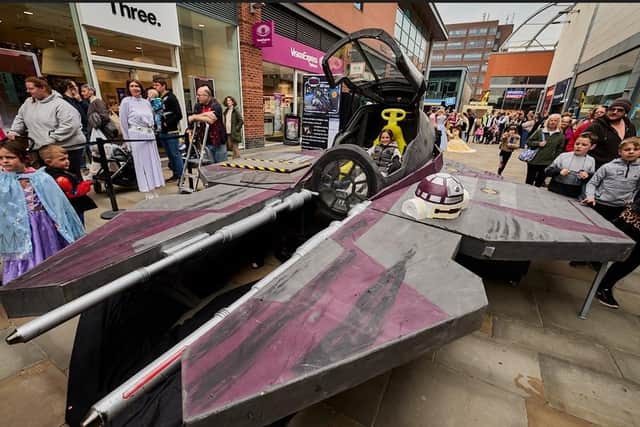 Photo opp props include Paddington’s bench, sit-on speeder inspired by Star Wars, Game of Thrones throne, Obi-Wan’s fan-made starfighter and giant toy boxes.