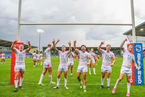 Rhinos players celebrate last Sunday's win at Salford, but coach Rohan Smith says they will be starting again against Hull KR on Friday. Picture by Olly Hassell/SWpix.com.