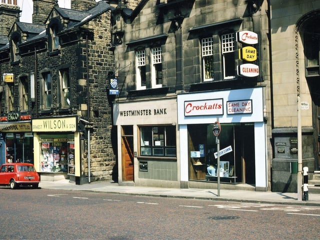 Shops on Queen Street almost opposite the Town Hall. The centre two shops are dated 1906. One of this pair is Crockatt's Dry Cleaners, which at this time along with Althams being the oldest traders in Queen Street, both being mentioned in Robinson's Trade Directory for 1905. The second shop is the Westminster Bank, soon to close with its merger with the National Provincial Bank. On the left the electrical firm of Greenside is shown before its takeover of Ernest Wilson's next door; later it went out of business due to the death of Raymond Williamson, the managing director.