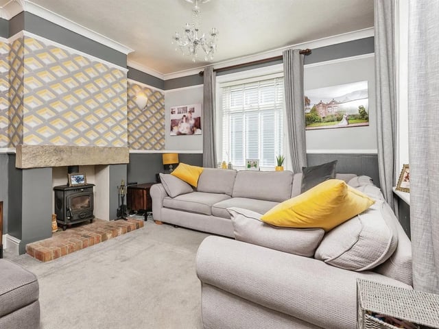 This light and airy room has Victorian style cornice mouldings to ceiling and a fire place to chimney breast recessed to both sides.