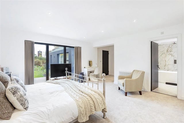A generous double bedroom featuring a dressing area and an extensive range of recessed wardrobes. Bi-folding doors provide a lovely southerly aspect and lead out to the rear garden.