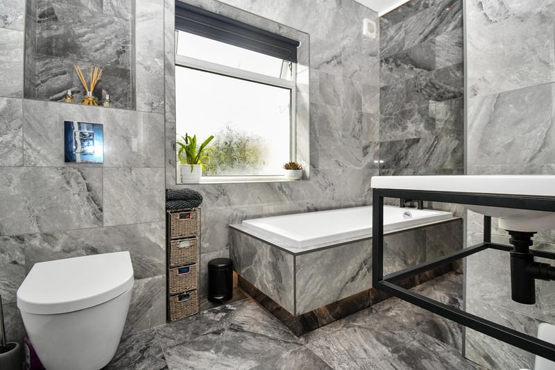 In addition to this luxurious house bathroom, there is also a guest WC/shower room.