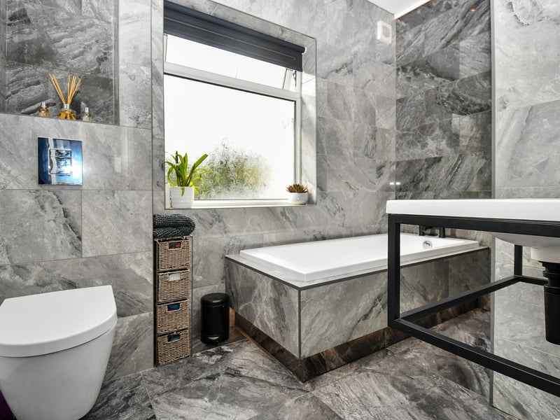 In addition to this luxurious house bathroom, there is also a guest WC/shower room.