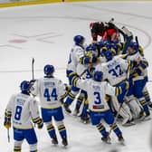 PARTY TIME: Leeds Knights' players mob Jordan Buesa (hidden) after his overtime winner against Swinon Wildcats on Sunday evening. Picture: Knights Media.