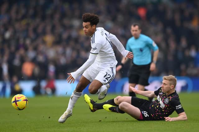 LEEDS, ENGLAND - JANUARY 22: Leeds player Tyler Adams skips the challenge of Ben Mee during the Premier League match between Leeds United and Brentford FC at Elland Road on January 22, 2023 in Leeds, England. (Photo by Stu Forster/Getty Images)
