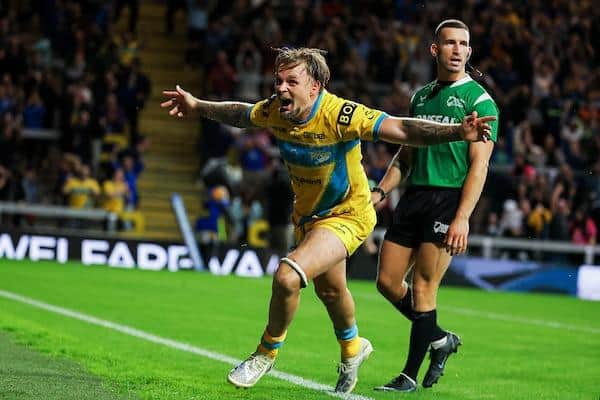 Blake Austin celebrates after scoring Rhinos' winning try against Giants. Picture by Alex Whitehead/SWpix.com.