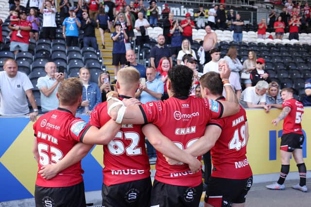 Salford players thank the travelling fans after last week's 80-6 hammering at Hull FC. Picture by John Clifton/SWpix.com.